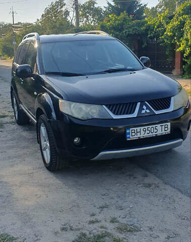 Чорний Міцубісі Аутлендер ХЛ, об'ємом двигуна 2.4 л та пробігом 325 тис. км за 7000 $, фото 1 на Automoto.ua