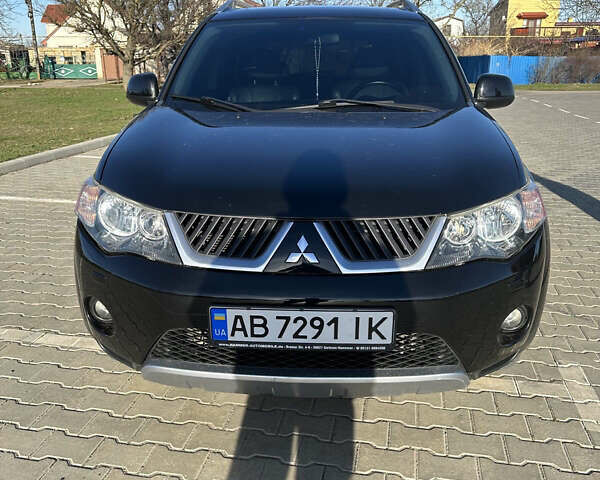 Черный Мицубиси Аутлендер ХЛ, объемом двигателя 2.4 л и пробегом 198 тыс. км за 11000 $, фото 1 на Automoto.ua
