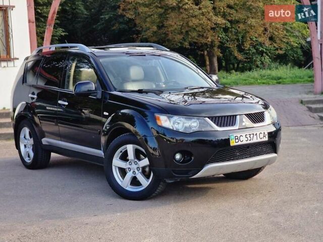 Черный Мицубиси Аутлендер ХЛ, объемом двигателя 2.36 л и пробегом 180 тыс. км за 7800 $, фото 1 на Automoto.ua