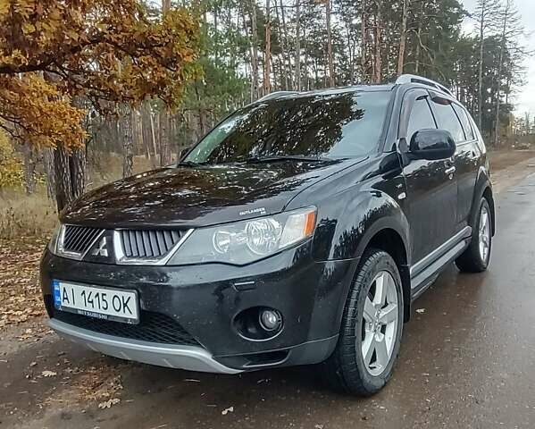Черный Мицубиси Аутлендер ХЛ, объемом двигателя 3 л и пробегом 240 тыс. км за 9400 $, фото 1 на Automoto.ua