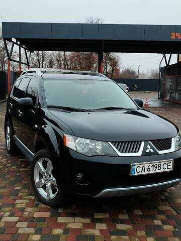 Чорний Міцубісі Аутлендер ХЛ, об'ємом двигуна 2.36 л та пробігом 150 тис. км за 11100 $, фото 1 на Automoto.ua