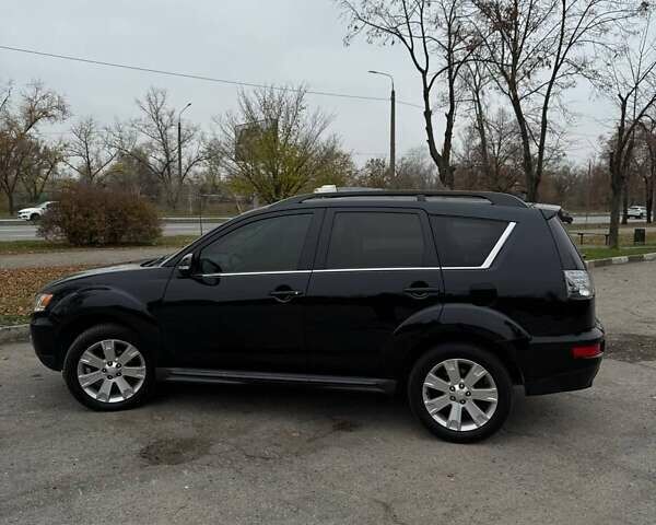 Черный Мицубиси Аутлендер ХЛ, объемом двигателя 2.18 л и пробегом 253 тыс. км за 12500 $, фото 1 на Automoto.ua