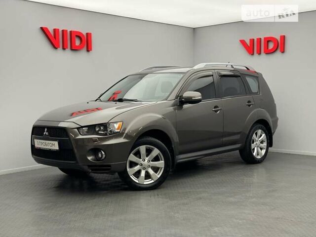 Коричневый Мицубиси Аутлендер ХЛ, объемом двигателя 2.4 л и пробегом 134 тыс. км за 10589 $, фото 1 на Automoto.ua