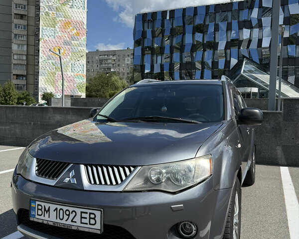 Серый Мицубиси Аутлендер ХЛ, объемом двигателя 3 л и пробегом 270 тыс. км за 9500 $, фото 1 на Automoto.ua
