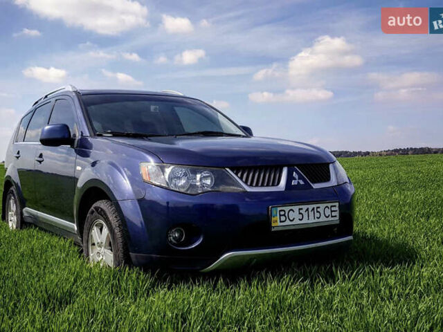 Синий Мицубиси Аутлендер ХЛ, объемом двигателя 2.4 л и пробегом 295 тыс. км за 7600 $, фото 1 на Automoto.ua