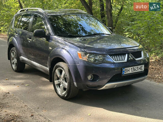 Синий Мицубиси Аутлендер ХЛ, объемом двигателя 2.4 л и пробегом 170 тыс. км за 7299 $, фото 1 на Automoto.ua