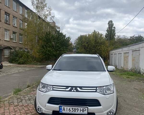 Белый Мицубиси Аутлендер, объемом двигателя 2.36 л и пробегом 152 тыс. км за 11500 $, фото 1 на Automoto.ua
