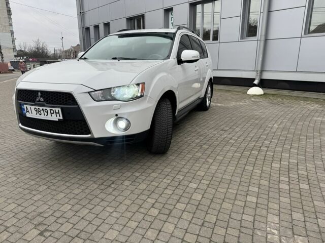Білий Міцубісі Аутлендер, об'ємом двигуна 2.4 л та пробігом 174 тис. км за 12500 $, фото 1 на Automoto.ua
