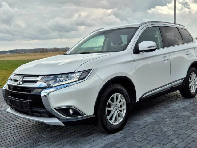 Белый Мицубиси Аутлендер, объемом двигателя 2 л и пробегом 100 тыс. км за 18100 $, фото 1 на Automoto.ua