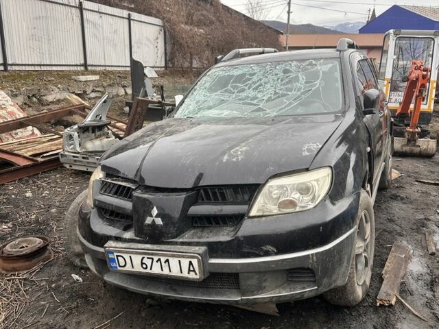 Черный Мицубиси Аутлендер, объемом двигателя 2 л и пробегом 200 тыс. км за 1499 $, фото 1 на Automoto.ua