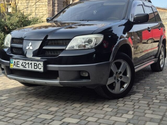 Черный Мицубиси Аутлендер, объемом двигателя 2.4 л и пробегом 260 тыс. км за 7500 $, фото 1 на Automoto.ua