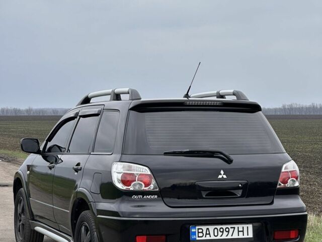 Чорний Міцубісі Аутлендер, об'ємом двигуна 2 л та пробігом 230 тис. км за 6300 $, фото 1 на Automoto.ua