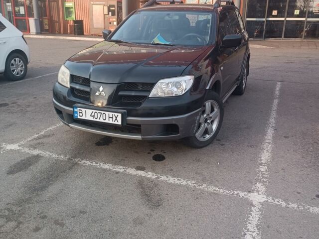 Черный Мицубиси Аутлендер, объемом двигателя 2.4 л и пробегом 280 тыс. км за 6500 $, фото 1 на Automoto.ua