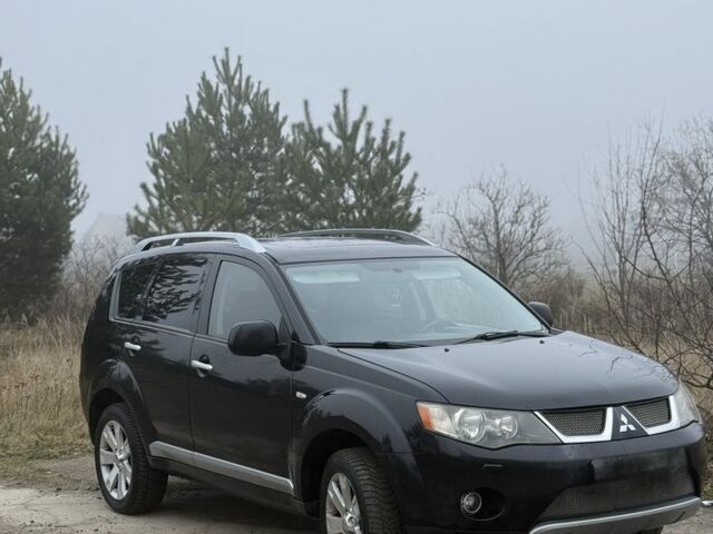 Чорний Міцубісі Аутлендер, об'ємом двигуна 2 л та пробігом 310 тис. км за 4500 $, фото 1 на Automoto.ua