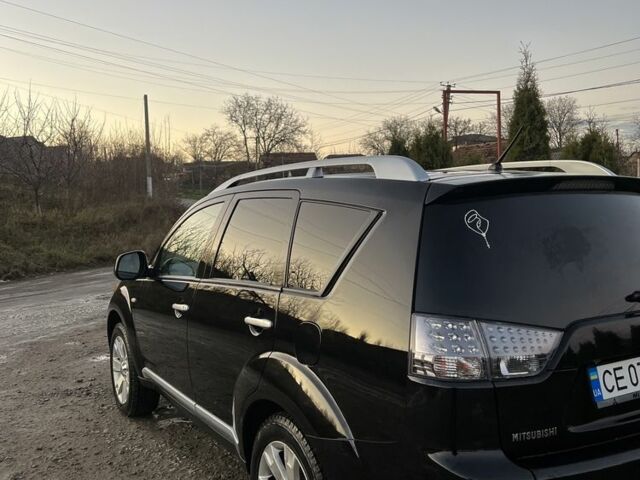 Черный Мицубиси Аутлендер, объемом двигателя 2.2 л и пробегом 238 тыс. км за 9700 $, фото 1 на Automoto.ua