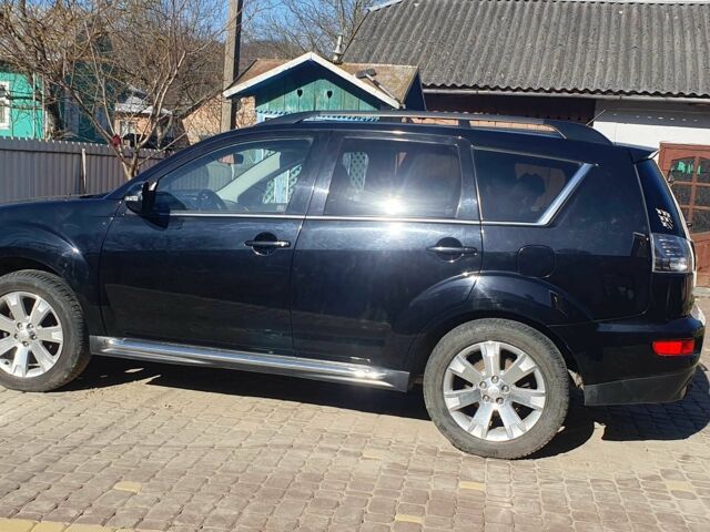 Черный Мицубиси Аутлендер, объемом двигателя 2.2 л и пробегом 213 тыс. км за 13000 $, фото 1 на Automoto.ua