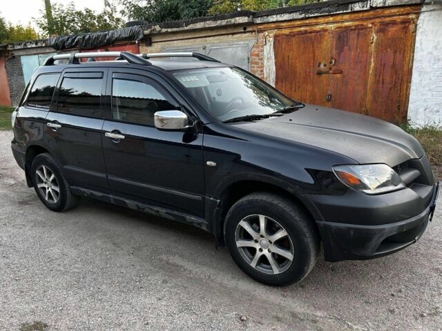 Черный Мицубиси Аутлендер, объемом двигателя 2 л и пробегом 390 тыс. км за 2500 $, фото 1 на Automoto.ua