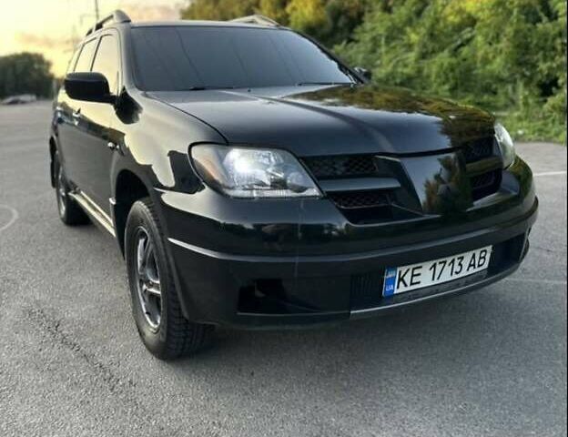 Черный Мицубиси Аутлендер, объемом двигателя 2.38 л и пробегом 212 тыс. км за 4800 $, фото 1 на Automoto.ua