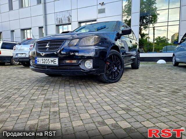 Чорний Міцубісі Аутлендер, об'ємом двигуна 2 л та пробігом 143 тис. км за 8500 $, фото 1 на Automoto.ua