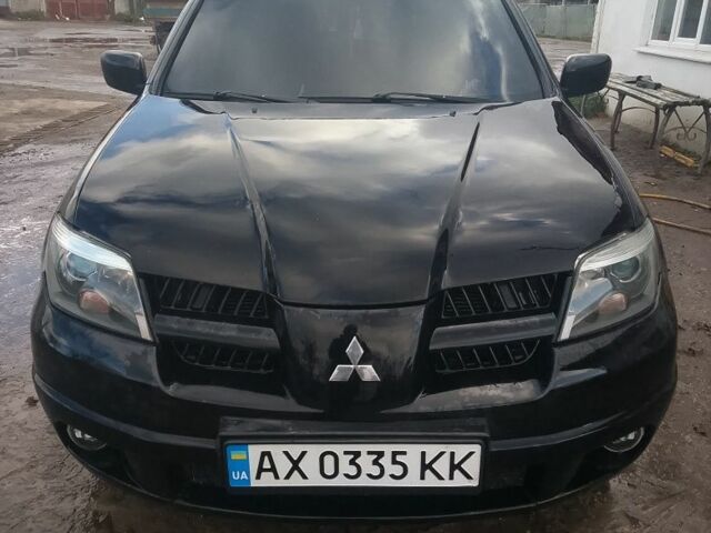 Черный Мицубиси Аутлендер, объемом двигателя 2.4 л и пробегом 3 тыс. км за 5500 $, фото 1 на Automoto.ua