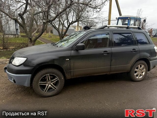 Черный Мицубиси Аутлендер, объемом двигателя 2.4 л и пробегом 357 тыс. км за 5190 $, фото 1 на Automoto.ua