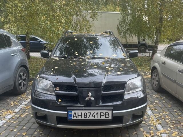 Чорний Міцубісі Аутлендер, об'ємом двигуна 2 л та пробігом 280 тис. км за 5701 $, фото 1 на Automoto.ua