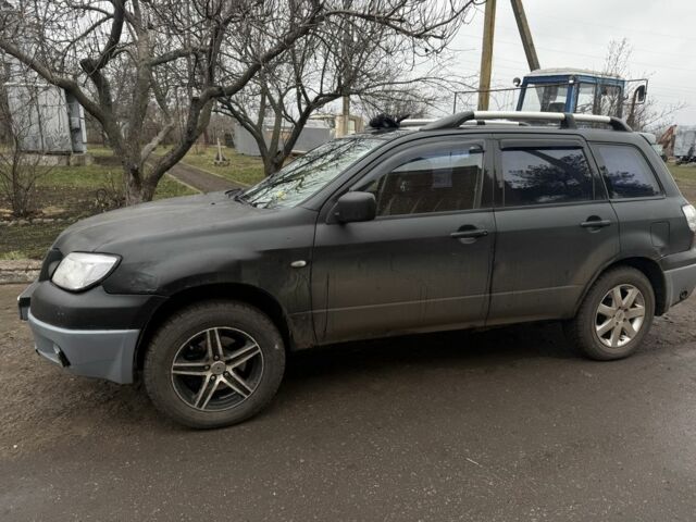 Черный Мицубиси Аутлендер, объемом двигателя 2.4 л и пробегом 3 тыс. км за 5208 $, фото 1 на Automoto.ua