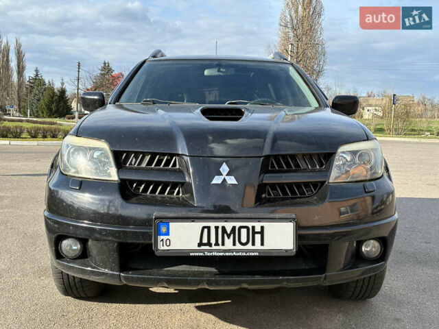 Черный Мицубиси Аутлендер, объемом двигателя 2 л и пробегом 333 тыс. км за 6200 $, фото 1 на Automoto.ua