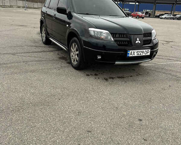 Чорний Міцубісі Аутлендер, об'ємом двигуна 2.38 л та пробігом 190 тис. км за 6800 $, фото 1 на Automoto.ua