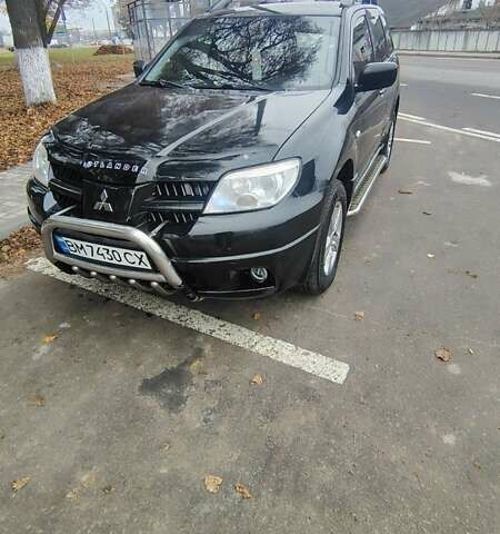 Черный Мицубиси Аутлендер, объемом двигателя 2 л и пробегом 330 тыс. км за 4997 $, фото 1 на Automoto.ua