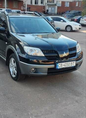 Міцубісі Аутлендер 2005 у Чернігові на Automoto.ua Чорний Міцубісі Аутлендер, об'ємом двигуна 2.38 л та пробігом 224 тис. км за 6000 $, фото 1 на Automoto.ua