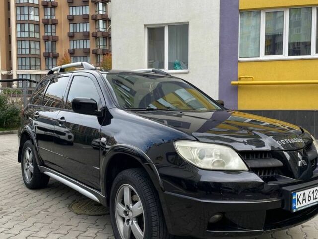 Черный Мицубиси Аутлендер, объемом двигателя 2.38 л и пробегом 270 тыс. км за 5900 $, фото 1 на Automoto.ua