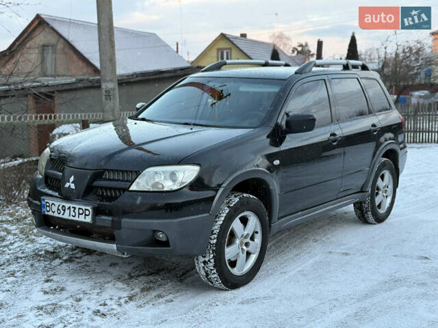 Чорний Міцубісі Аутлендер, об'ємом двигуна 2 л та пробігом 210 тис. км за 4499 $, фото 1 на Automoto.ua