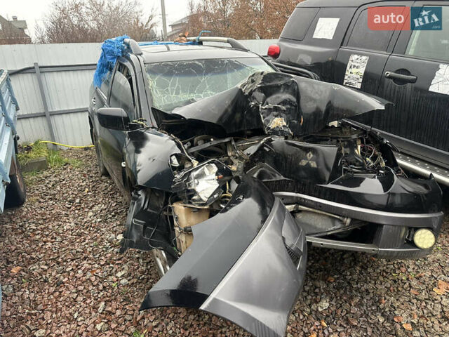 Черный Мицубиси Аутлендер, объемом двигателя 2.4 л и пробегом 240 тыс. км за 2200 $, фото 1 на Automoto.ua