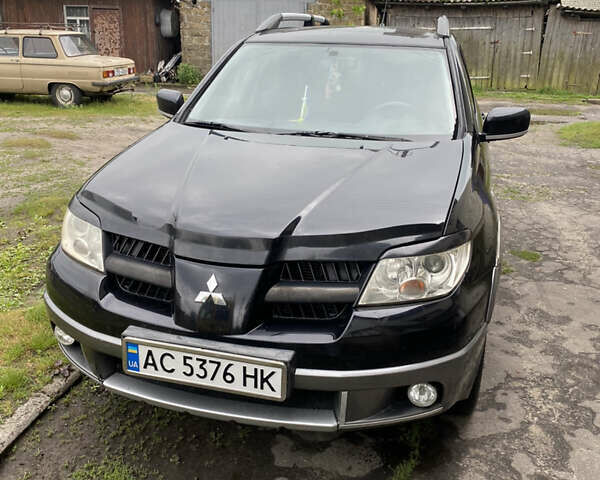 Чорний Міцубісі Аутлендер, об'ємом двигуна 2 л та пробігом 261 тис. км за 5900 $, фото 1 на Automoto.ua