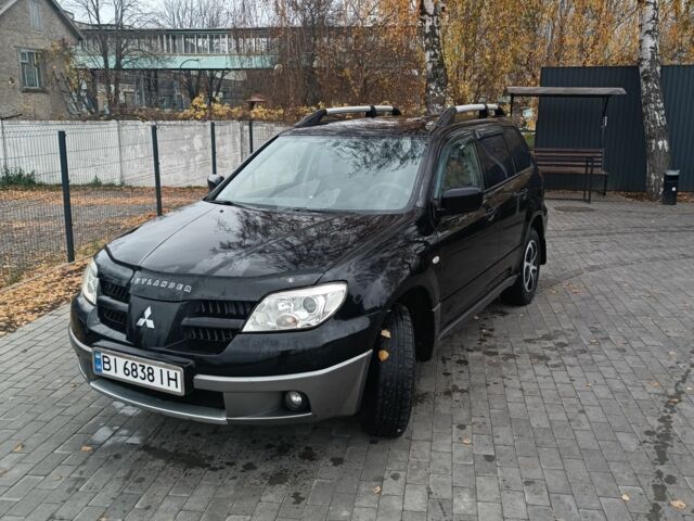 Чорний Міцубісі Аутлендер, об'ємом двигуна 2 л та пробігом 260 тис. км за 5400 $, фото 1 на Automoto.ua