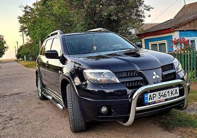 Чорний Міцубісі Аутлендер, об'ємом двигуна 2 л та пробігом 170 тис. км за 9000 $, фото 1 на Automoto.ua