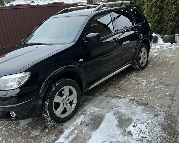 Чорний Міцубісі Аутлендер, об'ємом двигуна 2.4 л та пробігом 165 тис. км за 6800 $, фото 1 на Automoto.ua