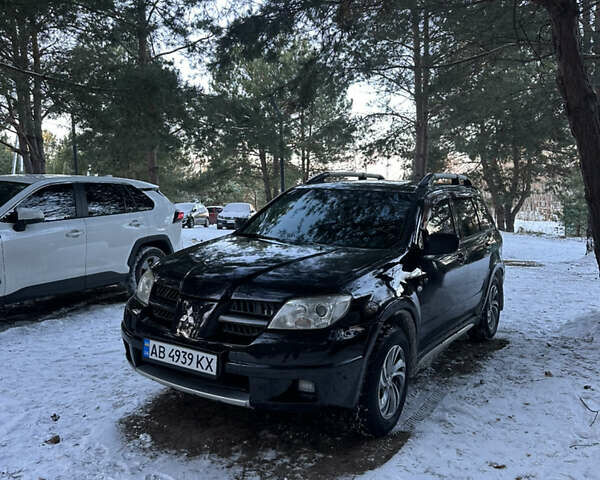 Чорний Міцубісі Аутлендер, об'ємом двигуна 2.38 л та пробігом 335 тис. км за 6900 $, фото 1 на Automoto.ua