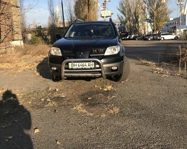 Чорний Міцубісі Аутлендер, об'ємом двигуна 2 л та пробігом 470 тис. км за 5300 $, фото 1 на Automoto.ua