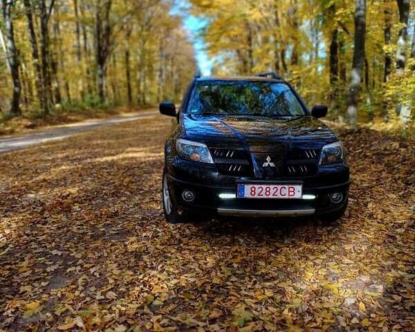 Чорний Міцубісі Аутлендер, об'ємом двигуна 2.4 л та пробігом 164 тис. км за 5100 $, фото 1 на Automoto.ua