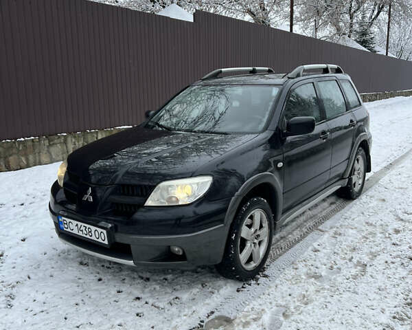Чорний Міцубісі Аутлендер, об'ємом двигуна 2.4 л та пробігом 308 тис. км за 4700 $, фото 1 на Automoto.ua