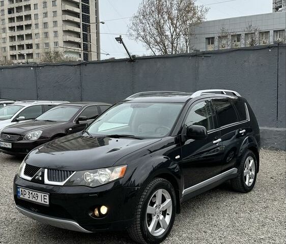 Черный Мицубиси Аутлендер, объемом двигателя 2.4 л и пробегом 240 тыс. км за 7650 $, фото 1 на Automoto.ua