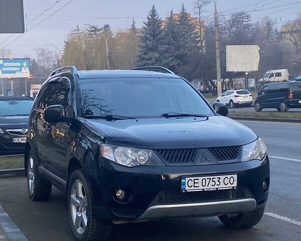 Черный Мицубиси Аутлендер, объемом двигателя 2.4 л и пробегом 240 тыс. км за 8300 $, фото 1 на Automoto.ua