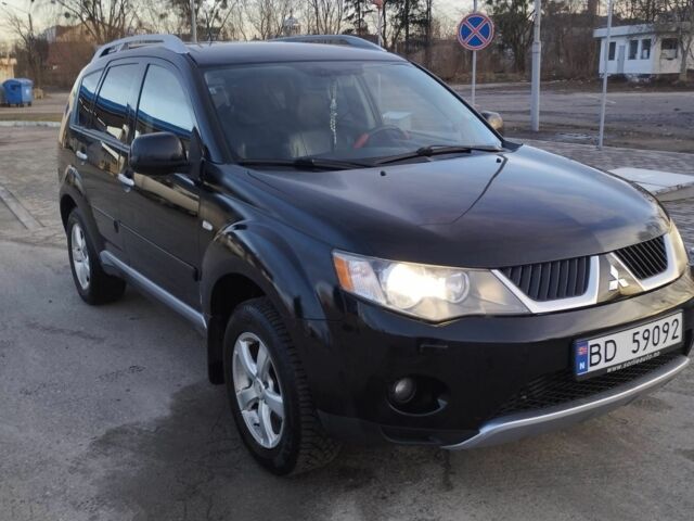 Черный Мицубиси Аутлендер, объемом двигателя 2 л и пробегом 290 тыс. км за 4900 $, фото 1 на Automoto.ua