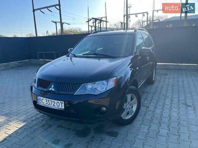 Чорний Міцубісі Аутлендер, об'ємом двигуна 2 л та пробігом 330 тис. км за 7500 $, фото 1 на Automoto.ua