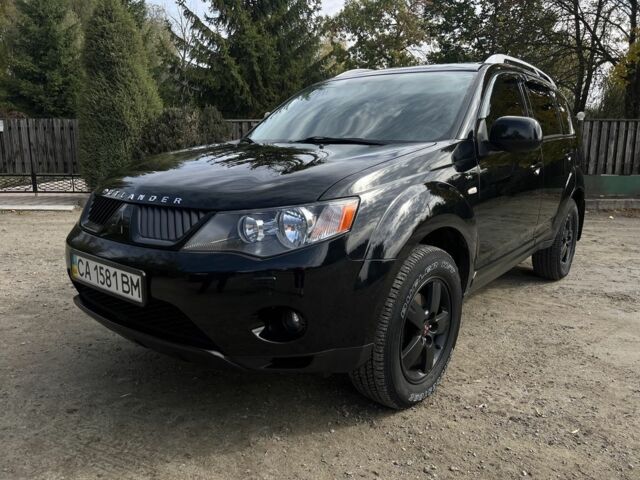 Черный Мицубиси Аутлендер, объемом двигателя 3 л и пробегом 139 тыс. км за 9800 $, фото 1 на Automoto.ua