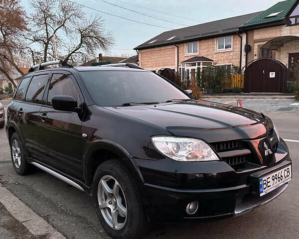 Черный Мицубиси Аутлендер, объемом двигателя 2.38 л и пробегом 270 тыс. км за 6500 $, фото 1 на Automoto.ua