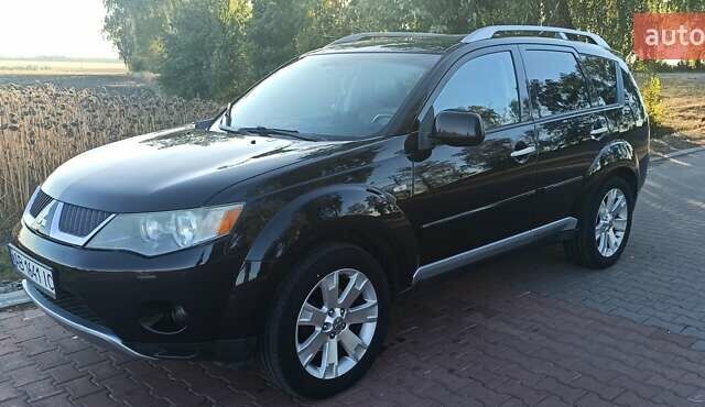 Черный Мицубиси Аутлендер, объемом двигателя 1.97 л и пробегом 244 тыс. км за 9000 $, фото 1 на Automoto.ua