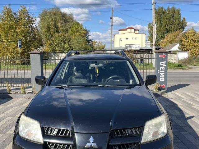 Чорний Міцубісі Аутлендер, об'ємом двигуна 2.4 л та пробігом 217 тис. км за 6199 $, фото 1 на Automoto.ua